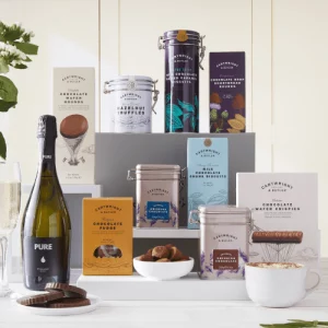 Image showing the contents of the Chocolate and Fizz Hamper laid out on a kitchen table